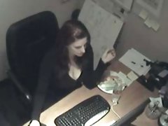 A sexy secretary fucks a carrot at her desk here